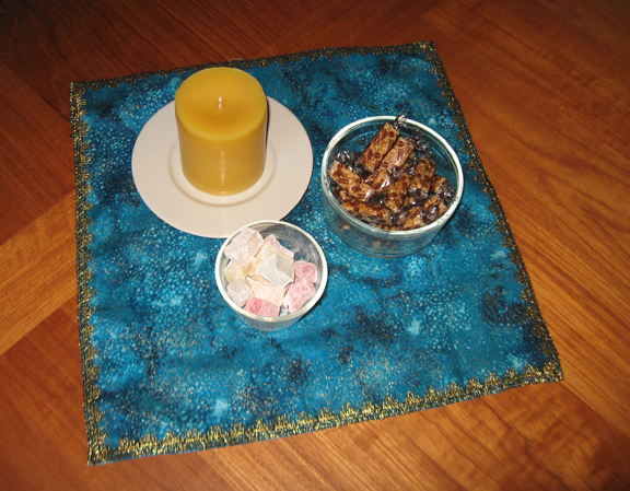 A candle, candy, and a cloth.